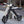 Load image into Gallery viewer, Cruzaa Scoota 240W Electric Scooter Carbon Black Racing White - Pedal &amp; Chain
