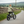 Load image into Gallery viewer, Hygge Vester electric folding bike square lifestyle image - sideways aligned with road
